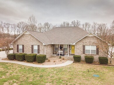 Tastefully landscaped level lot offers an inviting atmosphere.