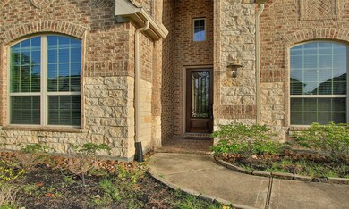 Lovely Combination of Brick and Stone on this home.