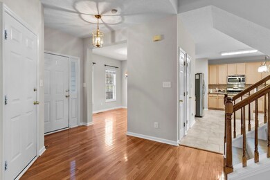 Spacious foyer with hardwood floors.