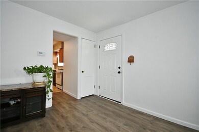 Entryway with Coat Closet and New Flooring