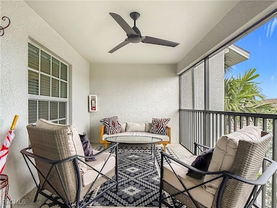 Balcony featuring ceiling fan and an outdoor living space