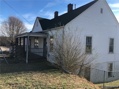 View of side of property with a chimney