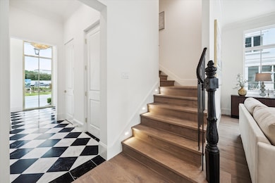 Additionally, black and white polished tile floor