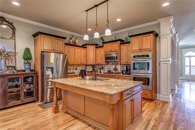 This kitchen is a chef's dream! Granite counter tops, gas cooktop, double ovens, and oversize island!