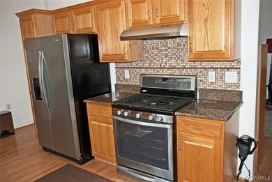 Kitchen with Granite counters, tile backsplash, ne