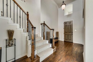 Beautiful entryway with high ceiling and gleaming 