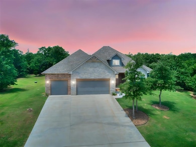 Craftsman-style home with stone siding, a garage, a front yard, driveway, and a shingled roof