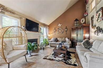 Main living area with fireplace and vaulted ceilin