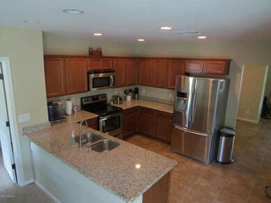 Kitchen w/ Birch Cabs, Granite, SS Appl.