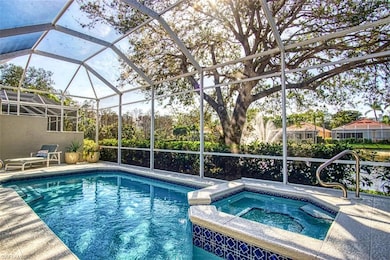 Custom pool and spa adjacent to an Oak tree overlo