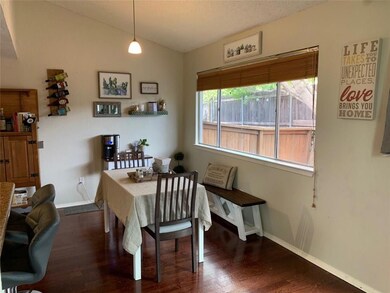 Dining space with baseboards, vaulted ceiling, an