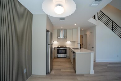 Kitchen featuring appliances with stainless steel