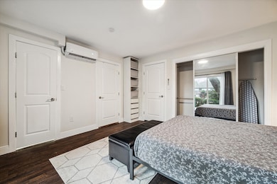 The separate primary bedroom with the ensuite bath