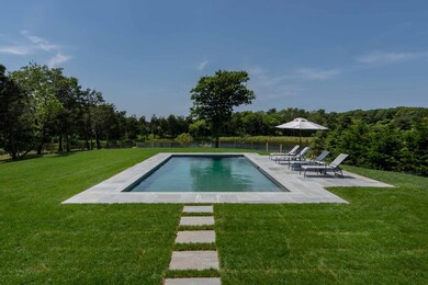 View of Pool and Distant Pond from Coverd  Porch