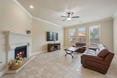 Cozy up in this spacious living room featuring a f