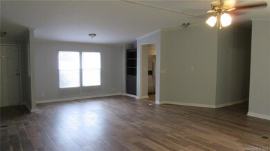 All new flooring & paint. Great room opens to dining area.