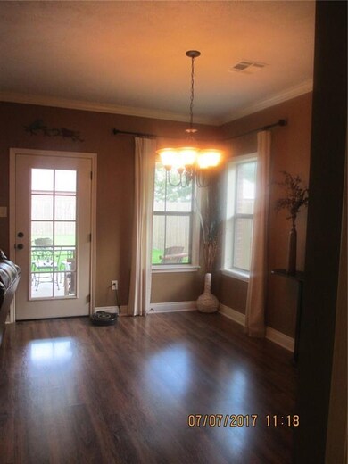 Dining are, plenty of natural light and door out t
