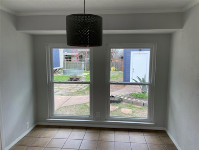 Unfurnished dining area featuring ornamental mold
