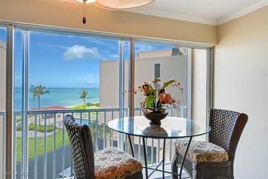 Sunroom featuring a water view