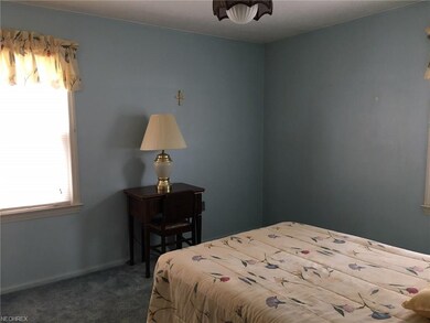 First floor bedroom. Hardwood under carpeting