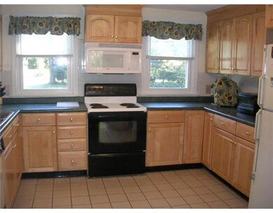 Kitchen. Lots of counter space & cabinets.  Tile f