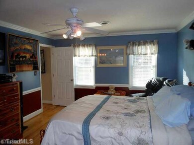 Master Bedroom. The master bedroom is spacious with wormy maple flooring and crown molding. The large walk in closet is rain forest cedar lined with lots of shelving.