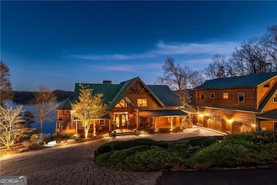 Custom built by Freddie Pethel with North Georgia Log Homes. Logs are Eastern Pine; Support poles from British Columbia