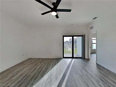 This is a picture of a previously completed home. Spare room featuring ceiling fan and light wood-type flooring