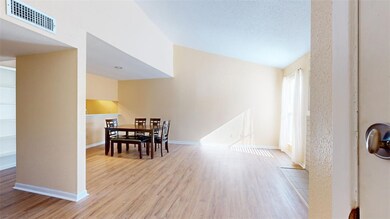 Dining area with light hardwood / wood-style floor