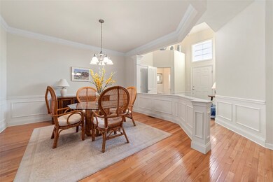 The foyer opens to the formal dining room.