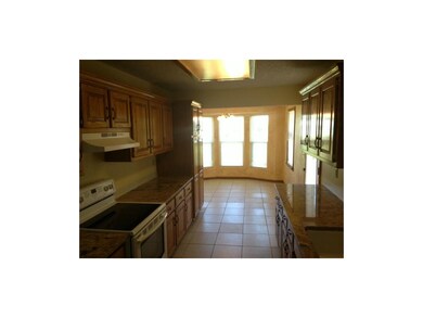 Galley style kitchen with large breakfast nook