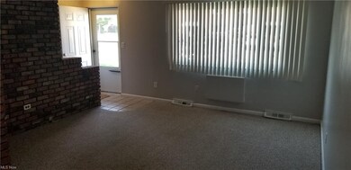 Living room - looking towards front door and front