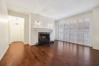 This inviting living room features elegant wood fl
