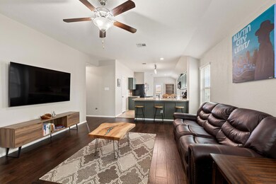 Living room featuring dark wood-type flooring, a 