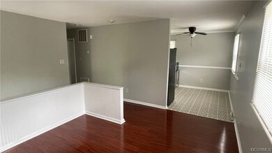 Living room with laminate floors and ceiling fan