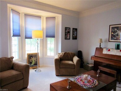 The living room is open to the left of the foyer. 
