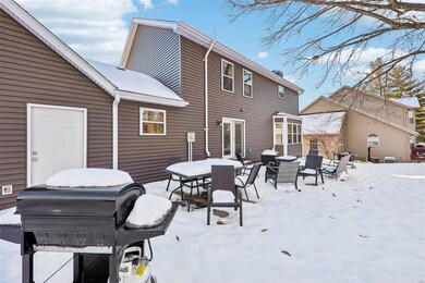 View of snow covered rear of property