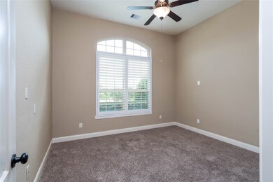 Front bedroom with large window with view of lake.