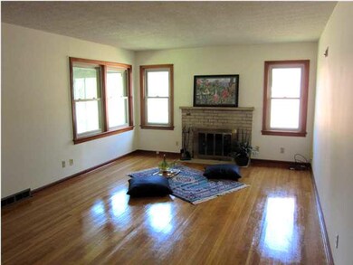 Spacious living room, hardwood floors, fireplace