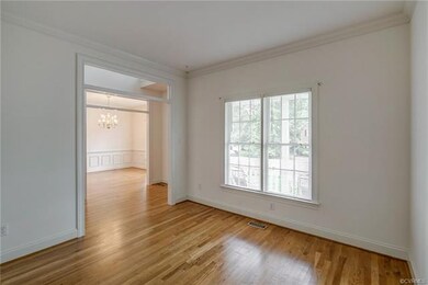 The formal living room is light and bright and pro