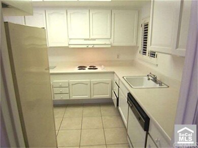 RAISED COUNTERS WITH NEWER TOPS. LARGE CERAMIC TIL