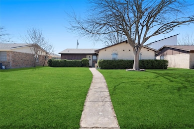 View of front of home featuring brick siding and a