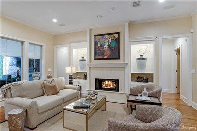 Another view of the fireplace and built-ins with a