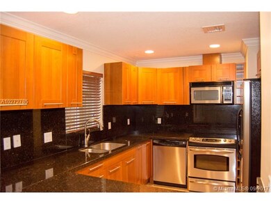 Open Kitchen with wood cabinets and stainless steel appliances