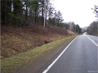Exterior Front. Road frontage shown on left in pic