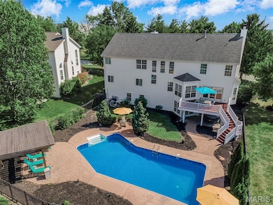 View of swimming pool with a patio area, stairway, a fenced backyard, and a wooden deck