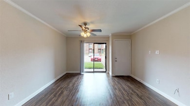 Spare room featuring dark wood-type flooring, crow