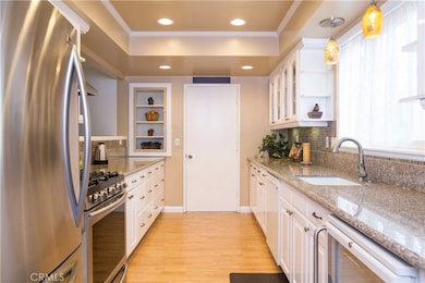 Remodeled kitchen with stainless steel appliances, custom cabinets and a touch of the past in the form of a built in retro china cabinet. Efficiency and charm. Designed to perfection!