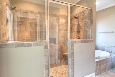Double sided tile shower w/ seating!