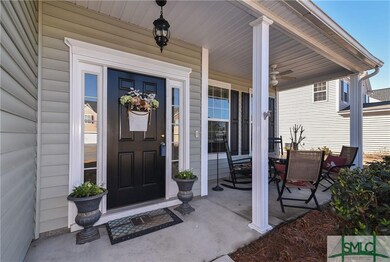 Covered front porch with fan & sitting area